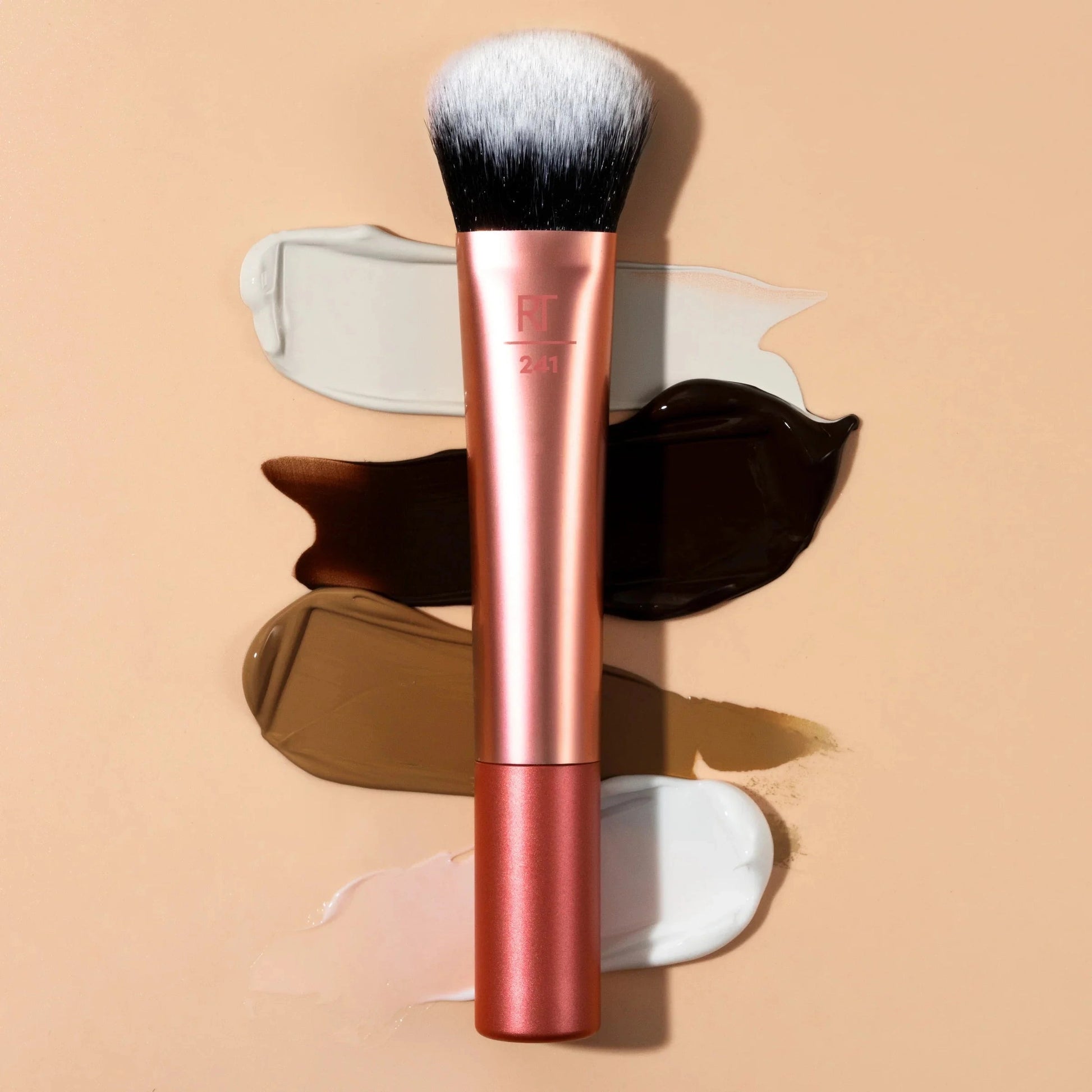 real technique seamless complexion brush cat paw shape hugs target areas +applies coverage seamlessly
