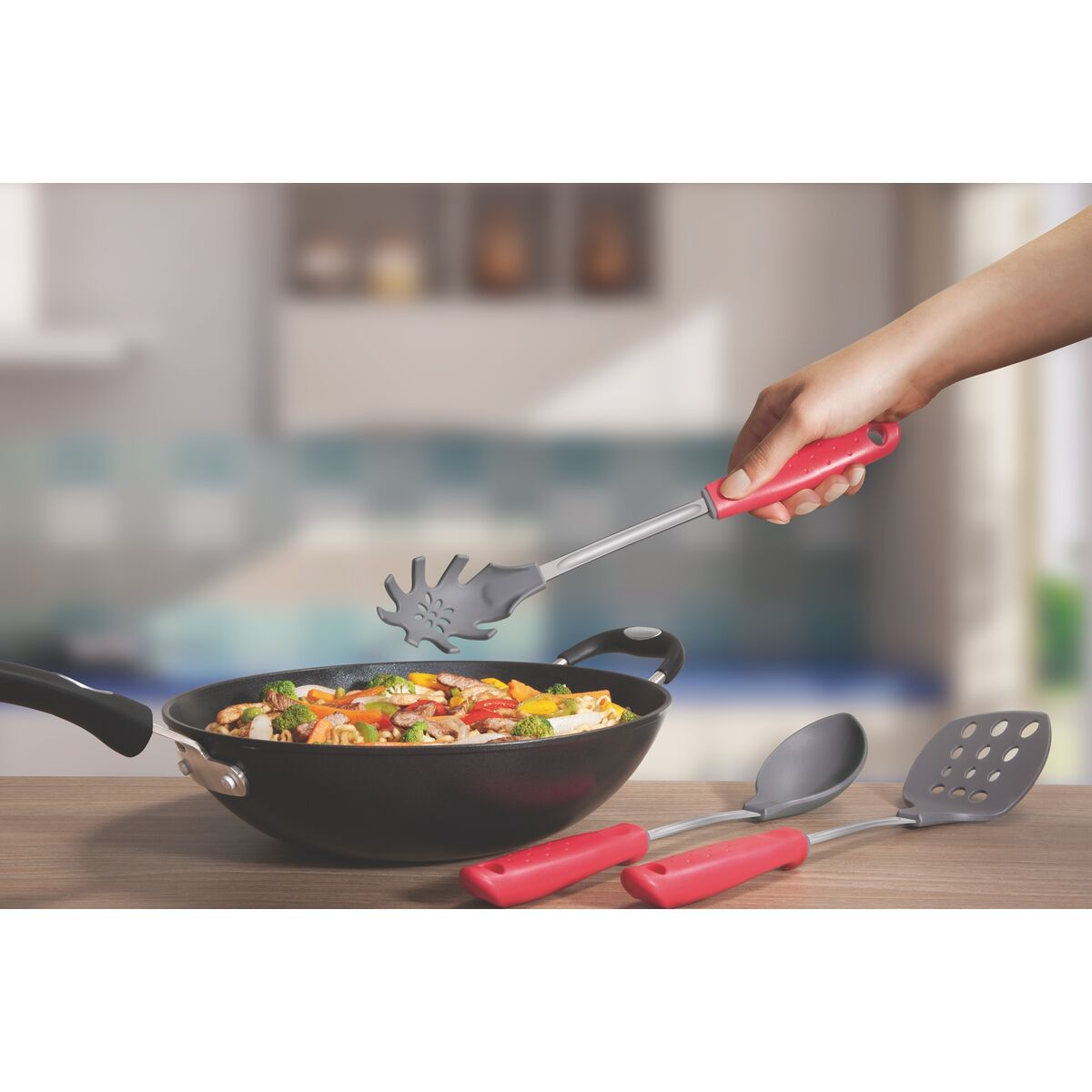 Tramontina universal spoon with red handle