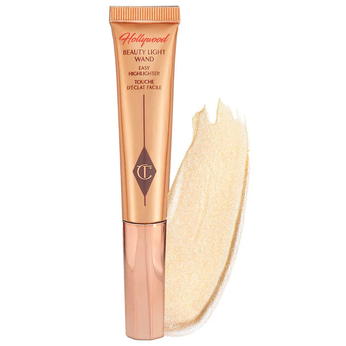 Charlotte Tilbury 
Beauty Highlighter Wand. Color: Spotlight - rose gold with silver light