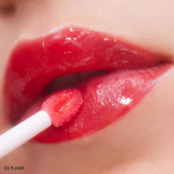 SEPHORA COLLECTION 
Outrageous Plump Intense Hydrating Lip Gloss.    Color: 03 Flame - shimmer free cherry red