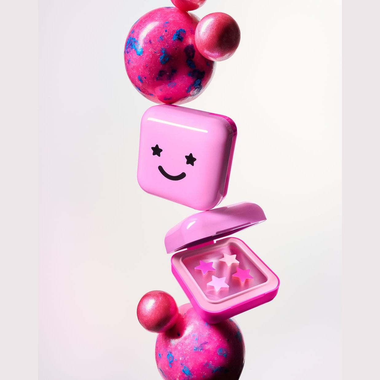 STARFACE hydro-stars® + big pink absorbs. shrinks. protects.  a cute pink  compact filled with 32 pink hydro-stars